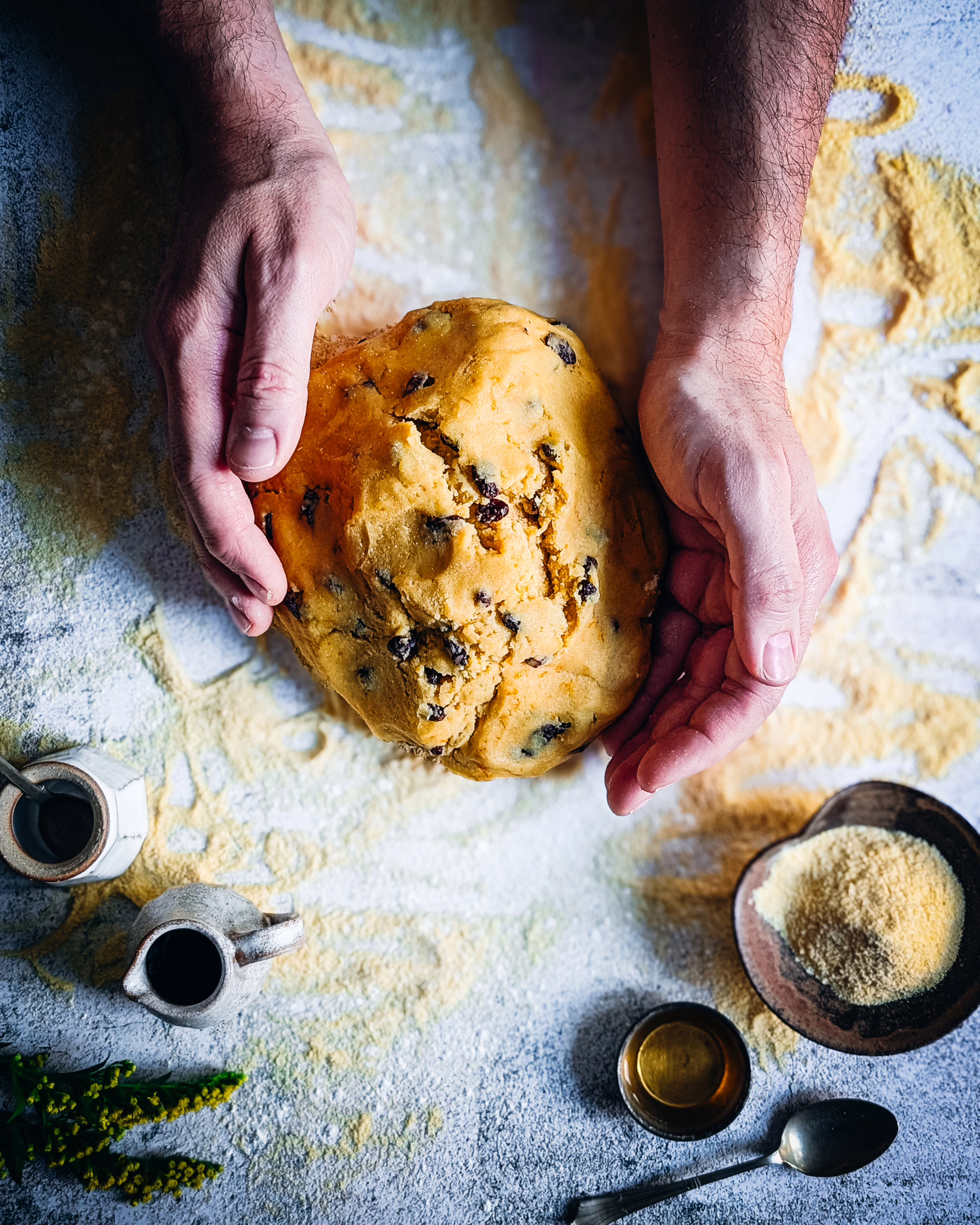 Person's hand working zaeti dough
