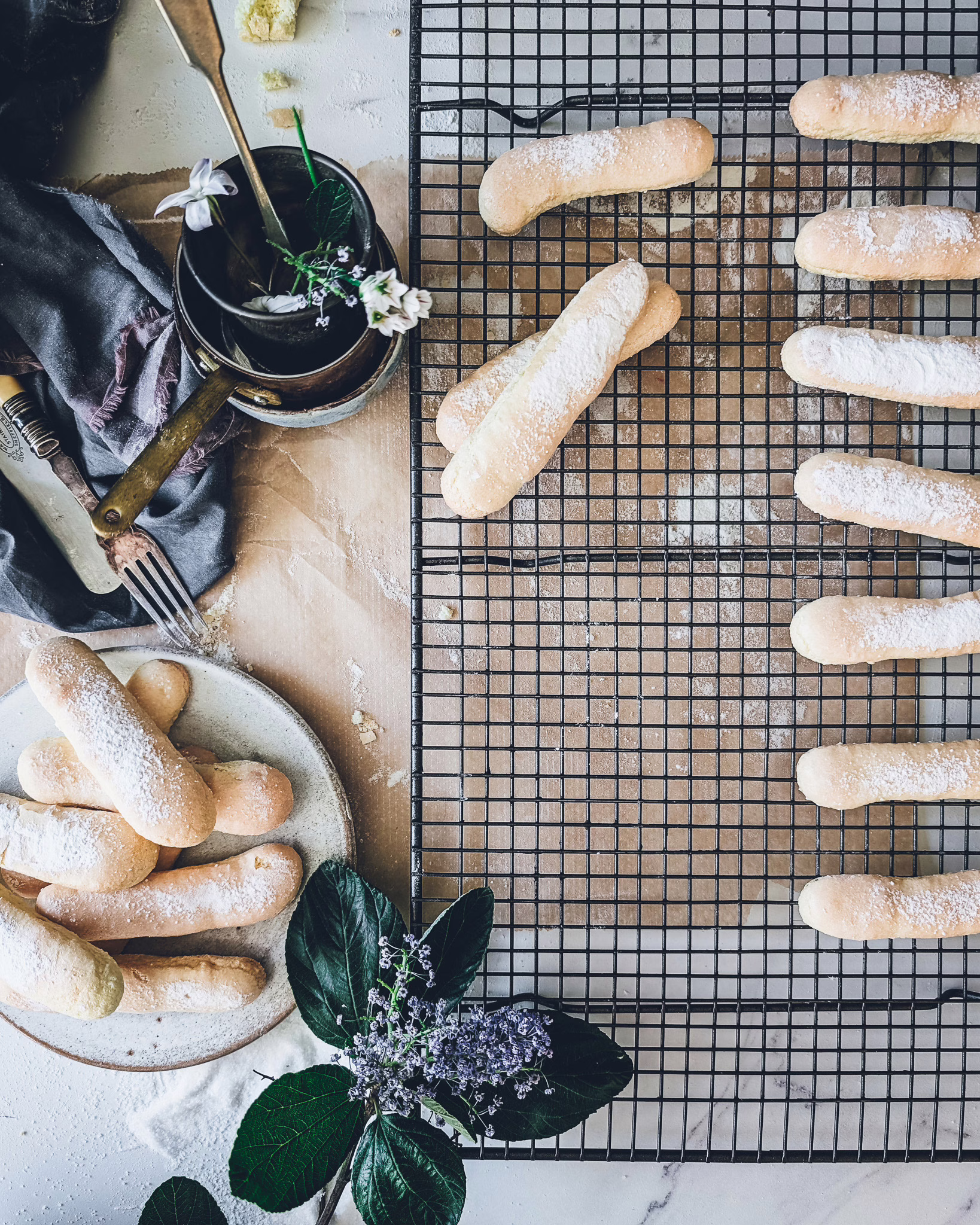 Ladyfingers cooling down on a backing tray