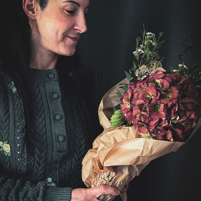 Woman holding a bunch of flowers