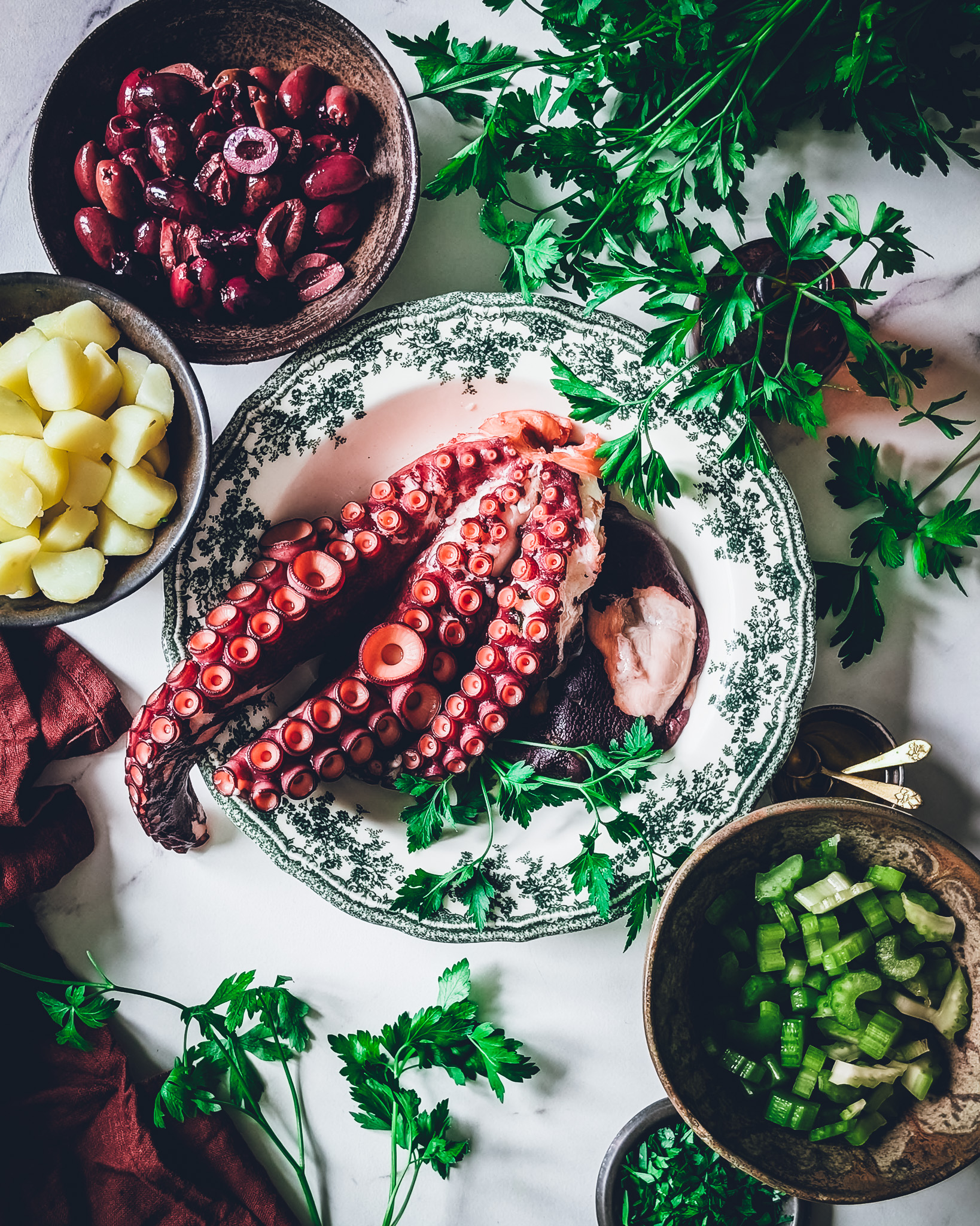 Ingredients for octopus and potato salad recipe on a table