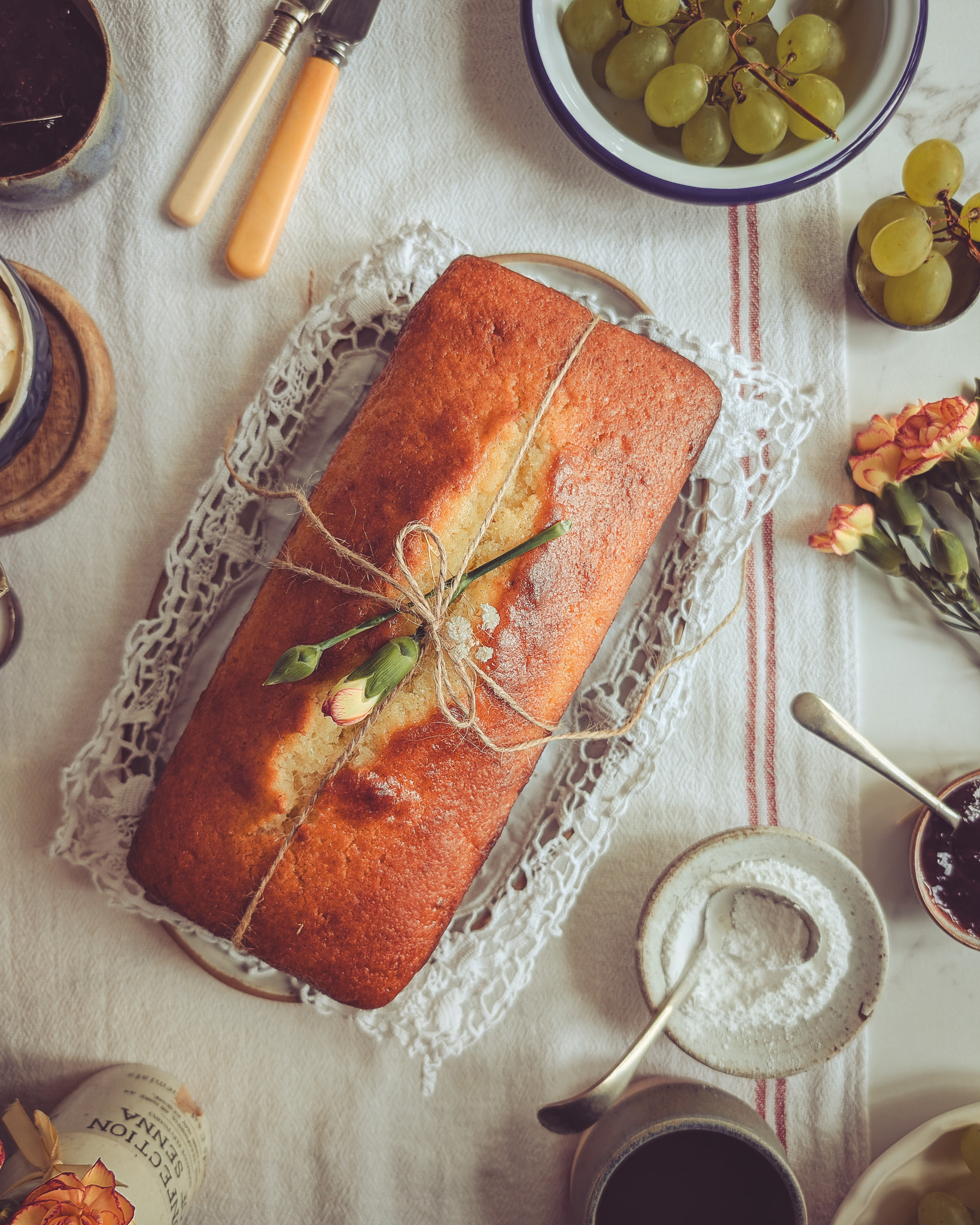 Yoghurt and rose loaf cake (Italian plum cake) on a table