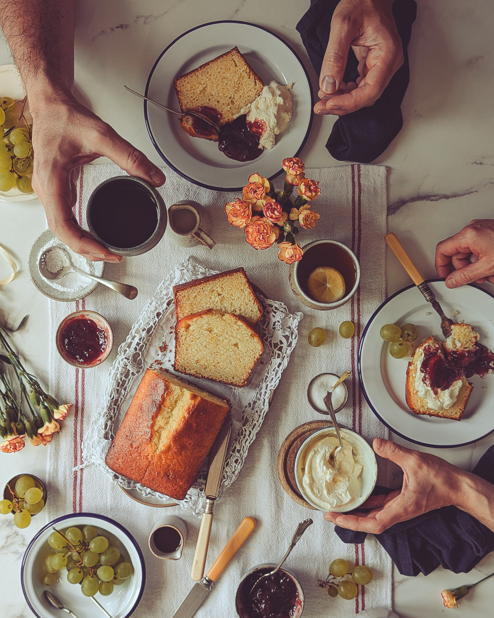 Two people eating Italian plumcake at a breakfast table
