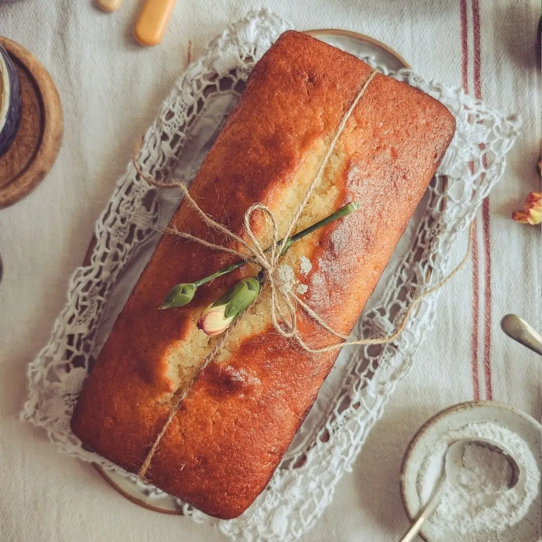 Yoghurt and rose loaf cake (Italian plum cake) on a table